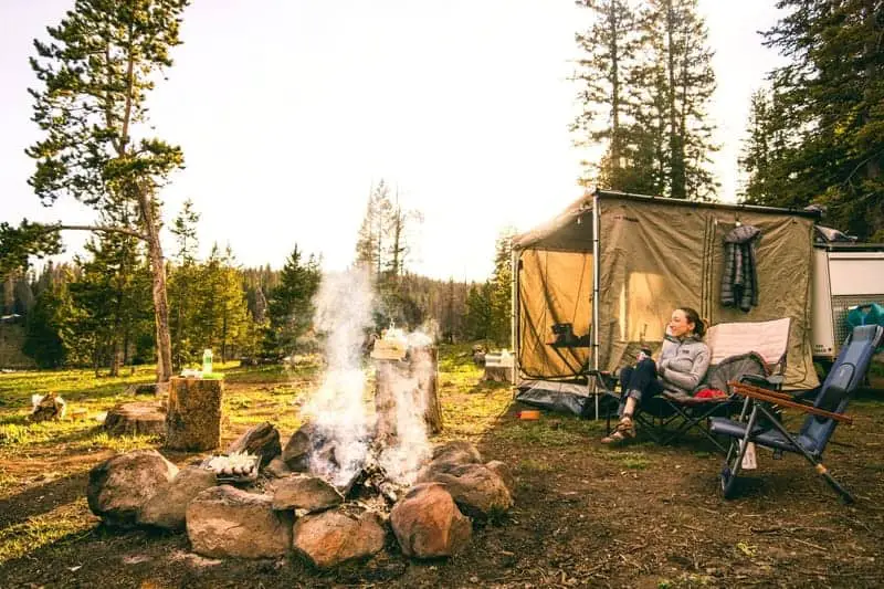 woman sitting on a foldable chair