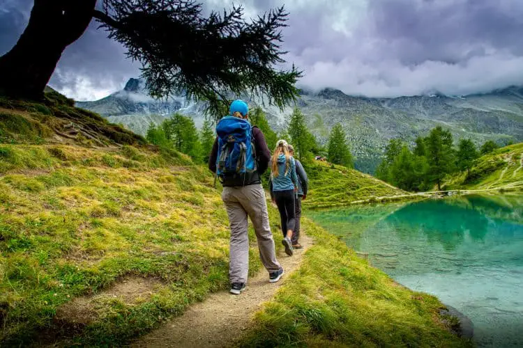 people hiking with removable daypacks