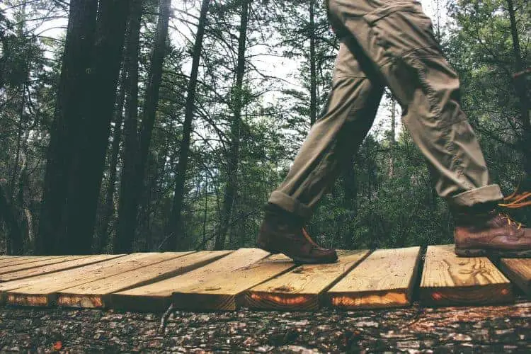 man walking with pants and hoses