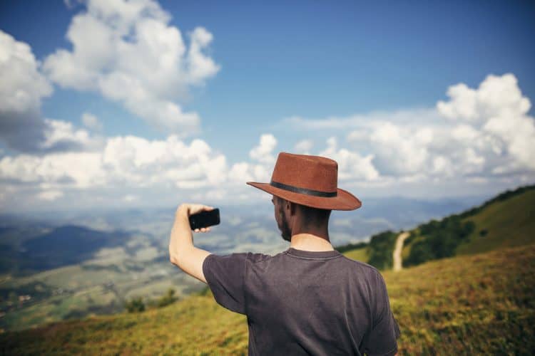 man taking selfie in the mountains