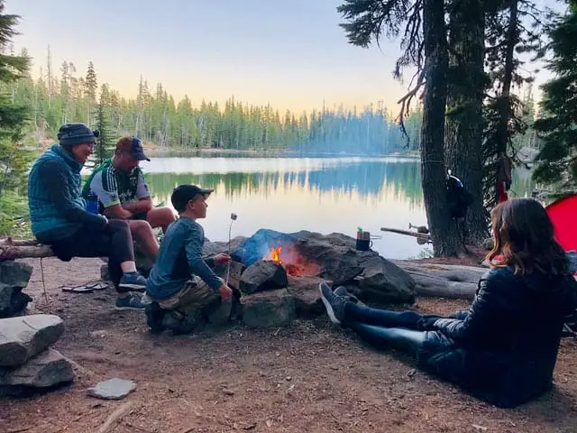 a family camping in the woods