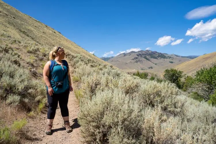 an overweight woman hiking