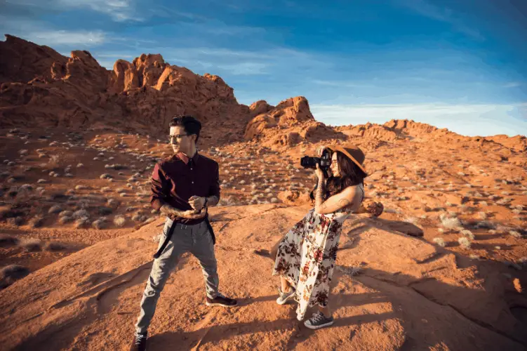 a couple hiking on a rocky terrain