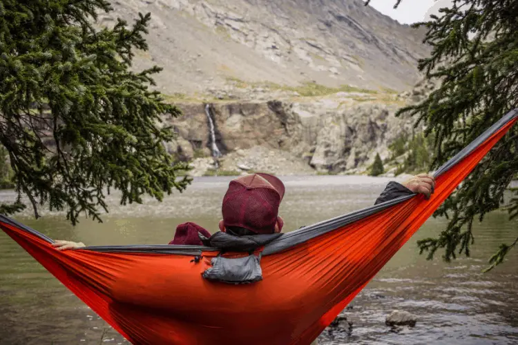 man liying in a hammock