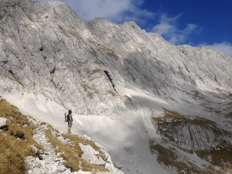 a woman hiking in the snowy mountains