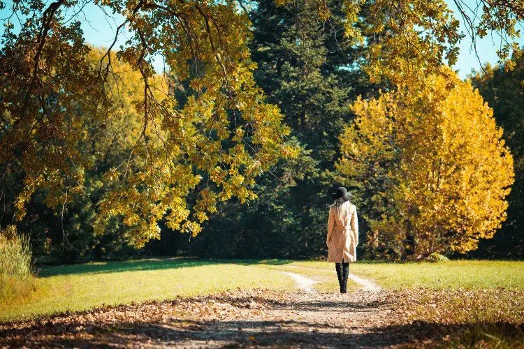 a woman walking in a park