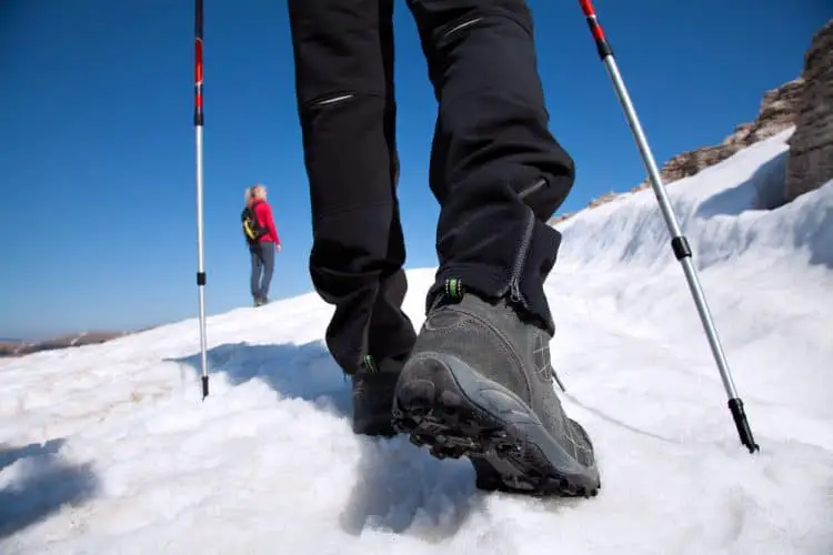 hiking boots on the snow mountain trail