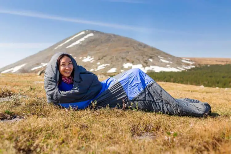 a woman in a sleeping bag