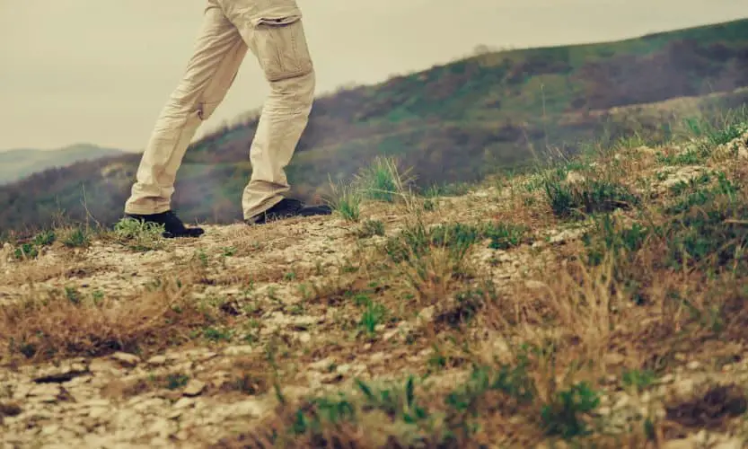 a man walking in the mountains