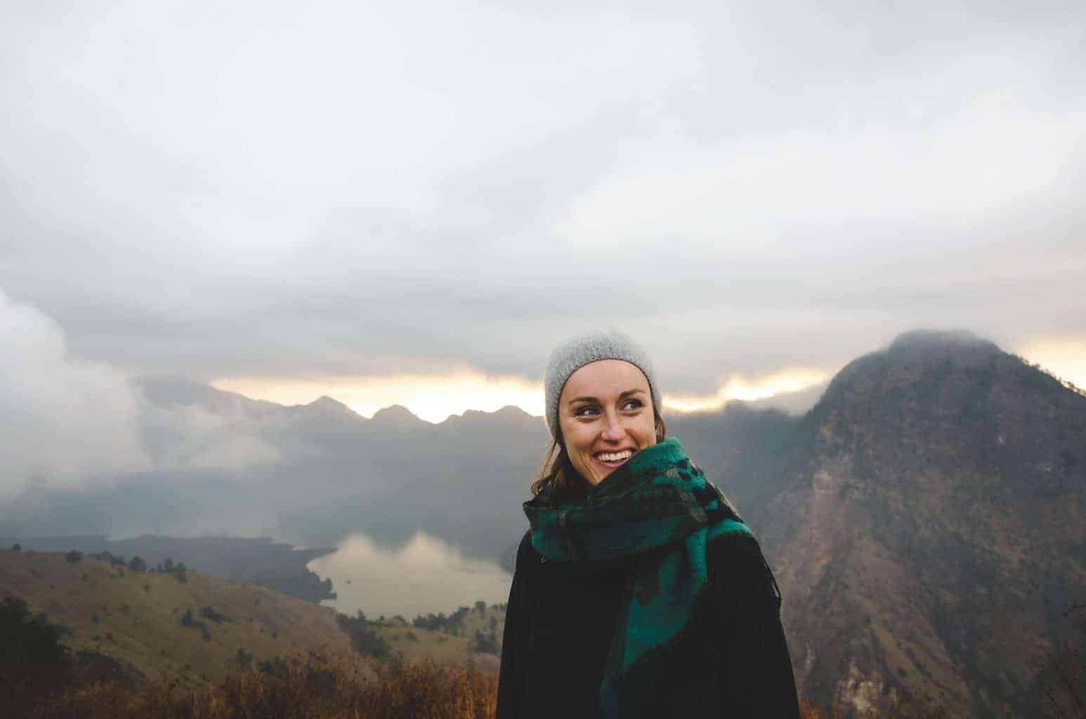 woman smiling while hiking